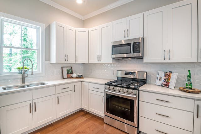 a%20kitchen%20with%20white%20cabinets%20and%20counters,%20wood%20flooring%20and%20stainless%20steel%20appliances a%20kitchen%20with%20white%20cabinets%20and%20counters,%20wood%20flooring%20and%20stainless%20steel%20appliances